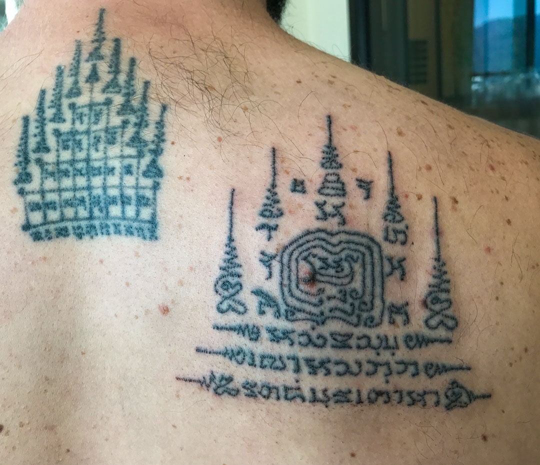 An authentic Sak Yant tattoo on a man’s back — among the best Sak Yant tattoo work in Thailand